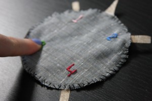 Press on the "buttons" to allow conductive fabrics to touch and trigger the function
