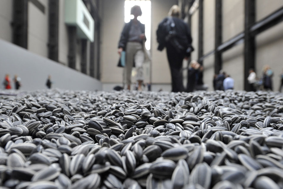 Visitors-walk-through-the-art-installation-Sunflower-Seeds-by-Chinese-artist-Ai-Weiwei-in-London