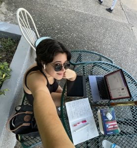 Picture of Adrianna Oquendo writing her thesis at the University of Puerto Rico, Mayagüez campus.