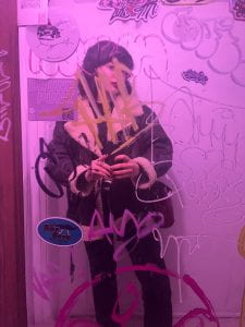 This is me standing in front of a mirror, covered in graffiti.